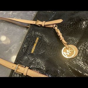 Michael Kors snake pattern shoulder bag.